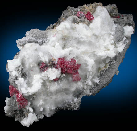 Cinnabar (penetration twins) on Calcite with Quartz from Red Bird Mine, Antelope Springs District, 24 km east of Lovelock, Pershing County, Nevada