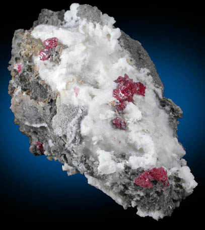 Cinnabar (penetration twins) on Calcite with Quartz from Red Bird Mine, Antelope Springs District, 24 km east of Lovelock, Pershing County, Nevada