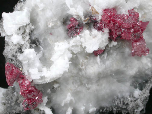 Cinnabar (penetration twins) on Calcite with Quartz from Red Bird Mine, Antelope Springs District, 24 km east of Lovelock, Pershing County, Nevada