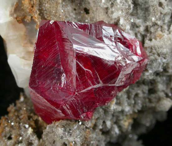 Cinnabar (penetration twins) on Calcite from Red Bird Mine, Antelope Springs District, 24 km east of Lovelock, Pershing County, Nevada