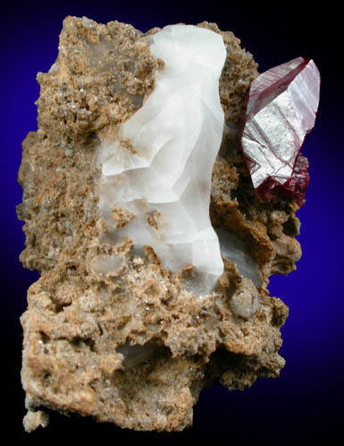 Cinnabar (penetration twin) on Quartz-rich matrix from Red Bird Mine, Antelope Springs District, 24 km east of Lovelock, Pershing County, Nevada