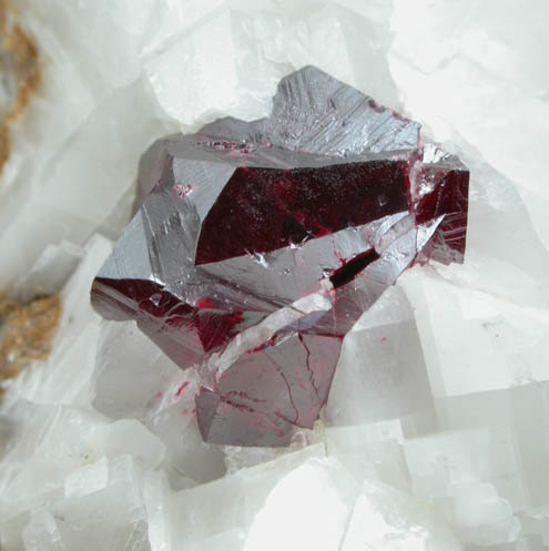 Cinnabar (penetration twin) on Calcite from Red Bird Mine, Antelope Springs District, 24 km east of Lovelock, Pershing County, Nevada