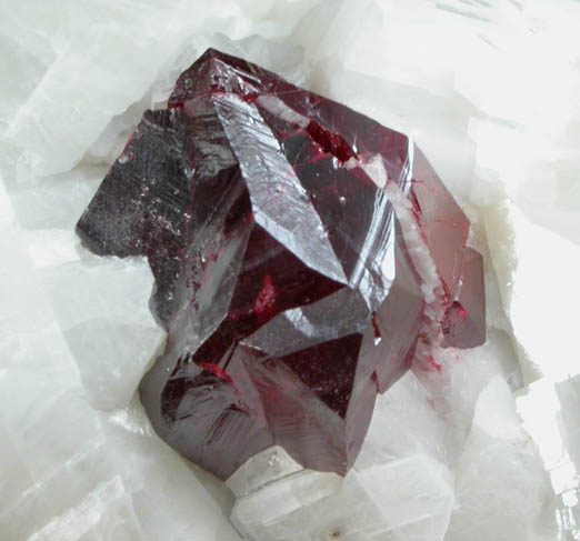 Cinnabar (penetration twin) on Calcite from Red Bird Mine, Antelope Springs District, 24 km east of Lovelock, Pershing County, Nevada