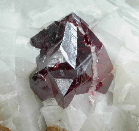 Cinnabar (penetration twin) on Calcite from Red Bird Mine, Antelope Springs District, 24 km east of Lovelock, Pershing County, Nevada