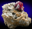 Cinnabar (penetration twin) on Quartz-rich matrix from Red Bird Mine, Antelope Springs District, 24 km east of Lovelock, Pershing County, Nevada