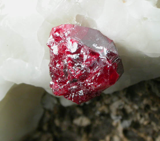 Cinnabar (penetration twins) on Calcite from Red Bird Mine, Antelope Springs District, 24 km east of Lovelock, Pershing County, Nevada
