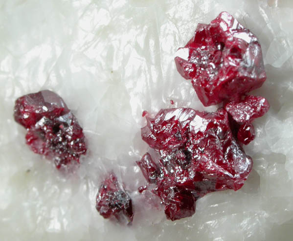 Cinnabar (penetration twins) on Calcite from Red Bird Mine, Antelope Springs District, 24 km east of Lovelock, Pershing County, Nevada