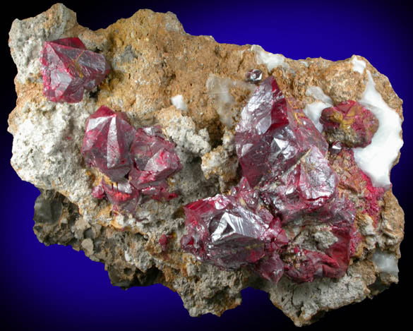 Cinnabar (penetration twins) on Quartz-rich matrix from Red Bird Mine, Antelope Springs District, 24 km east of Lovelock, Pershing County, Nevada