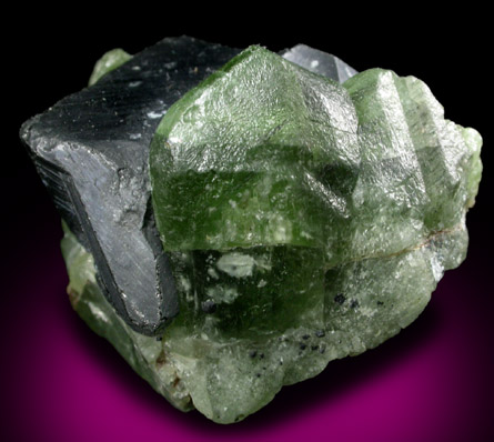Forsterite var. Peridot with Ludwigite inclusions on Magnetite from Suppatt, Kohistan District, North-West Frontier Province, Pakistan