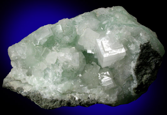 Hydroxyapophyllite-(K) (formerly apophyllite-(KOH)) on Prehnite from Fairfax Quarry, 6.4 km west of Centreville, Fairfax County, Virginia