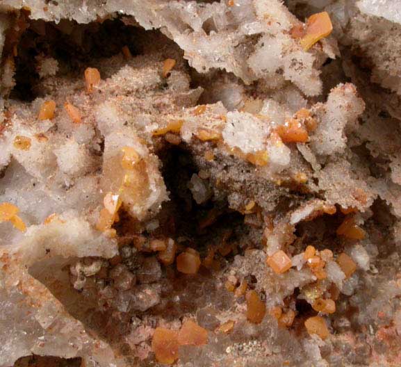 Wulfenite on Quartz from Manhan Lead Mines, Loudville District, 3 km northwest of Easthampton, Hampshire County, Massachusetts