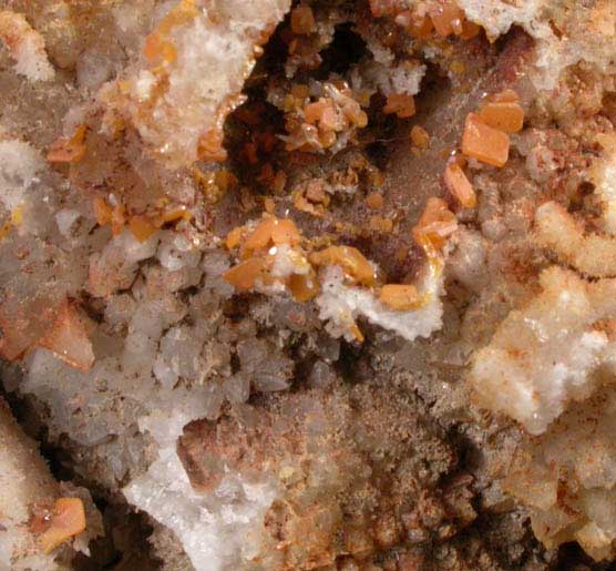 Wulfenite on Quartz from Manhan Lead Mines, Loudville District, 3 km northwest of Easthampton, Hampshire County, Massachusetts