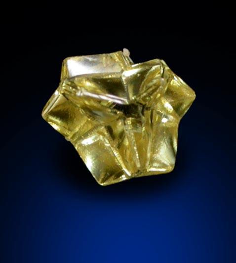 Diamond (0.15 carat fancy intense yellow cavernous crystal) from Mbuji-Mayi (Miba), 300 km east of Tshikapa, Democratic Republic of the Congo