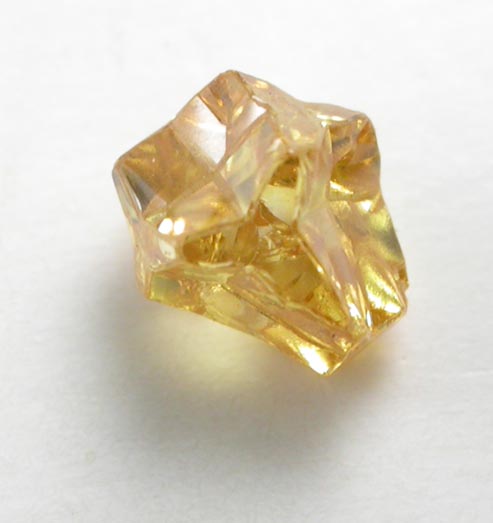 Diamond (0.25 carat fancy intense yellow cavernous crystal) from Mbuji-Mayi (Miba), 300 km east of Tshikapa, Democratic Republic of the Congo