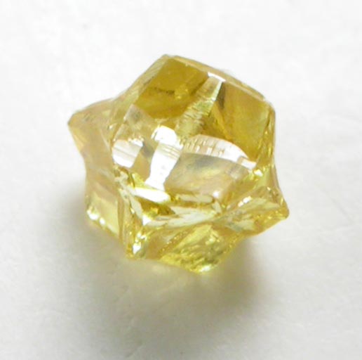 Diamond (0.17 carat fancy intense yellow cavernous crystal) from Mbuji-Mayi (Miba), 300 km east of Tshikapa, Democratic Republic of the Congo