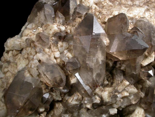 Quartz var. Smoky Quartz (Dauphin-law twins) on Microcline from Moat Mountain, west of North Conway, Carroll County, New Hampshire