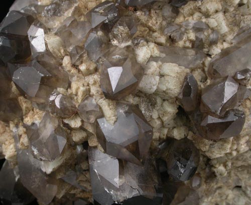 Quartz var. Smoky Quartz (Dauphin-law twins) on Microcline from Moat Mountain, west of North Conway, Carroll County, New Hampshire