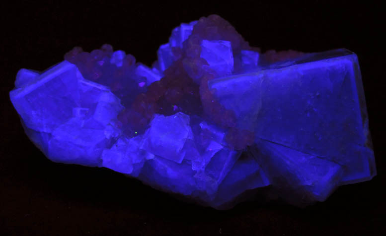 Photo below under shortwave ultraviolet illumination of Fluorite with Calcite from Weardale, County Durham, England Fluorite with Calcite from Weardale, County Durham, England