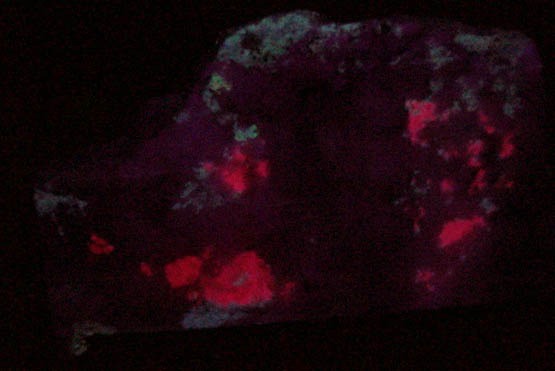 Tugtupite (tenebrescent) from Kuannersuit (Kvanefjeld), Ilimaussaq Complex, Narsaq, Kitaa Province, Greenland