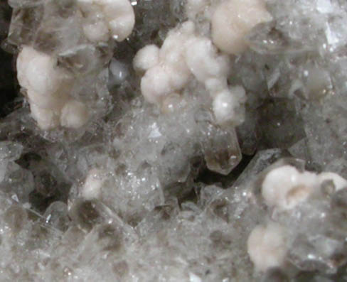 Bastnsite-(Ce) on Quartz from Poudrette Quarry, Mont Saint-Hilaire, Qubec, Canada