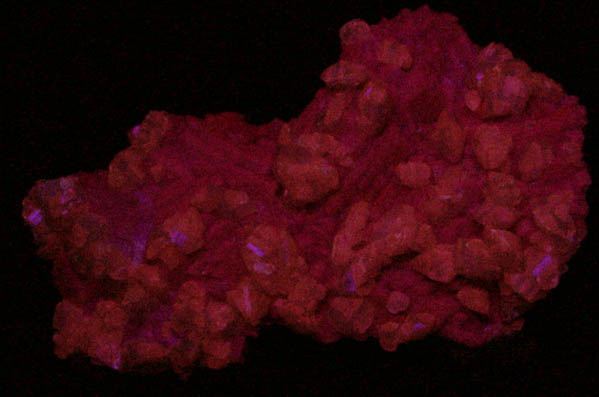 Photo below under shortwave ultraviolet illumination of Calcite on Dolomite molds after Calcite from Tsumeb Mine, Otavi-Bergland District, Oshikoto, Namibia Calcite on Dolomite molds after Calcite from Tsumeb Mine, Otavi-Bergland District, Oshikoto, Namibia