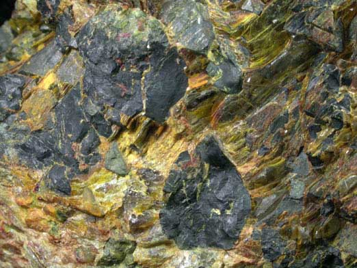 Uraninite with Uranophane, Gummite (Becquerelite-Fourmarierite) from Aldrich Quarry, Stoneham, Oxford County, Maine