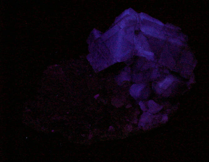 Photo below under shortwave ultraviolet illumination of Fluorite on Quartz from William Wise Mine, Westmoreland, Cheshire County, New Hampshire Fluorite on Quartz from William Wise Mine, Westmoreland, Cheshire County, New Hampshire
