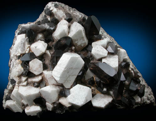Quartz var. Smoky Quartz (Dauphiné-law twins) on Microcline from Moat Mountain, Hales Location, west of North Conway, Carroll County, New Hampshire