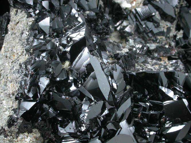 Cassiterite (twinned crystals) on Muscovite from Xuebaoding Mountain near Pingwu, Sichuan Province, China