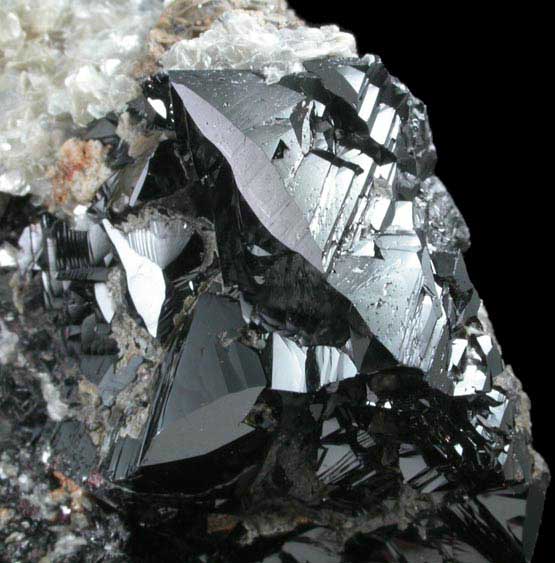 Cassiterite (twinned crystals) on Muscovite from Xuebaoding Mountain near Pingwu, Sichuan Province, China