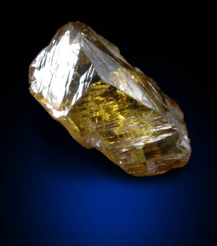 Diamond (0.55 carat fancy-intense yellow-orange asymmetric partial crystal) from Argyle Mine, Kimberley, Western Australia, Australia