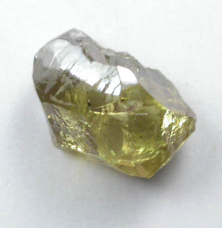 Diamond (0.47 carat fancy-greenish-yellow elongated partial crystal) from Argyle Mine, Kimberley, Western Australia, Australia