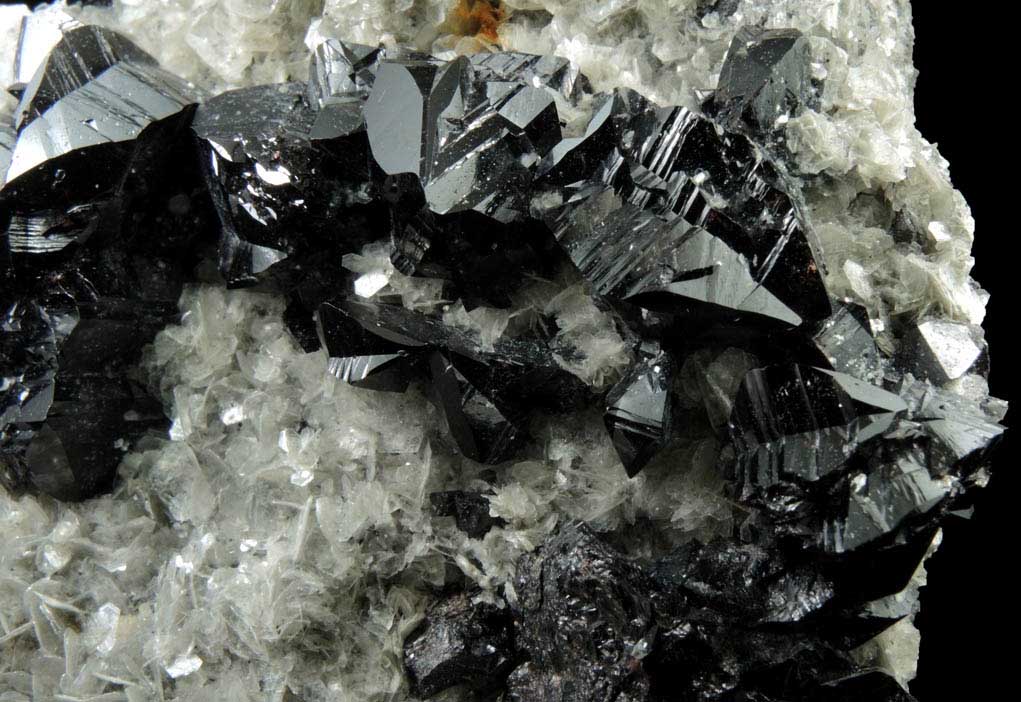 Cassiterite (twinned crystals) on Muscovite from Xuebaoding Mountain near Pingwu, Sichuan Province, China