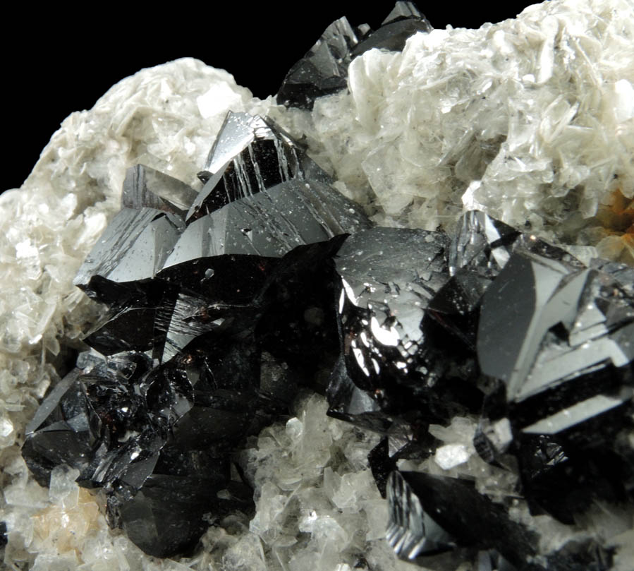 Cassiterite (twinned crystals) on Muscovite from Xuebaoding Mountain near Pingwu, Sichuan Province, China