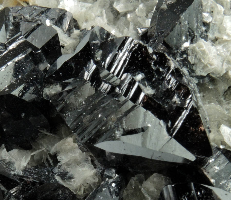 Cassiterite (twinned crystals) on Muscovite from Xuebaoding Mountain near Pingwu, Sichuan Province, China