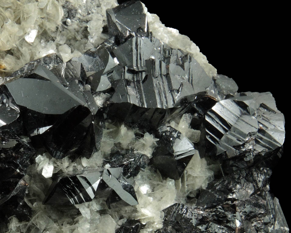 Cassiterite (twinned crystals) on Muscovite from Xuebaoding Mountain near Pingwu, Sichuan Province, China