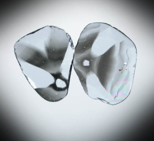Diamond (two matched polished slices with sector-zoned inclusions totaling 0.48 carats) from Zimbabwe