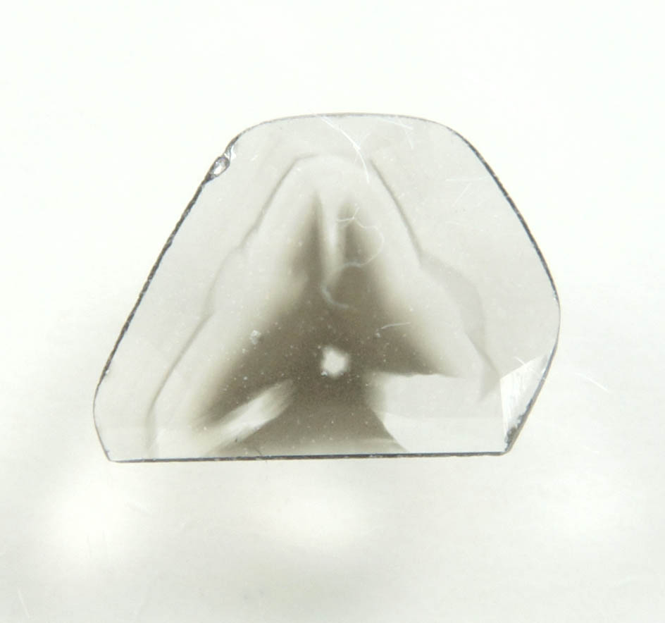 Diamond (0.24 carat polished slice with sector-zoned inclusions) from Zimbabwe