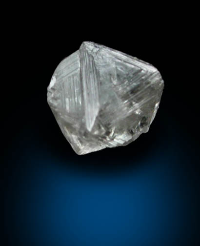 Diamond (0.06 carat pale-brown macle, twinned crystal) from Fuxian, Lianing Province, China