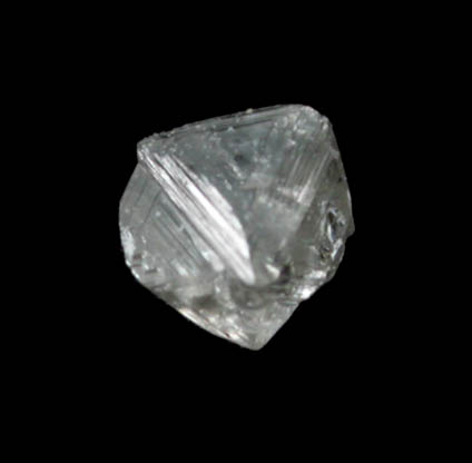 Diamond (0.06 carat pale-brown macle, twinned crystal) from Fuxian, Lianing Province, China