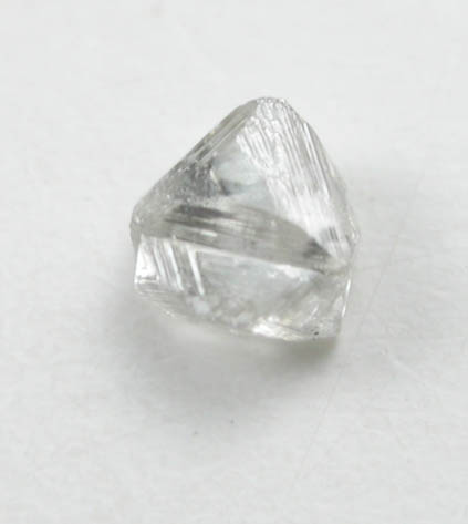 Diamond (0.06 carat pale-brown macle, twinned crystal) from Fuxian, Lianing Province, China