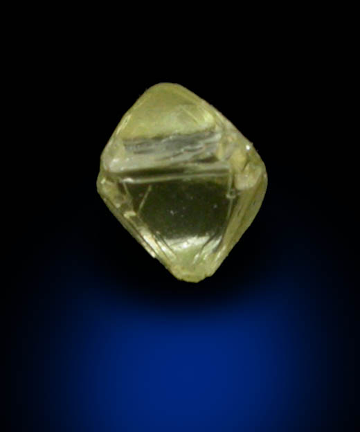 Diamond (0.05 carat yellow octahedral crystal) from Fuxian, Lianing Province, China