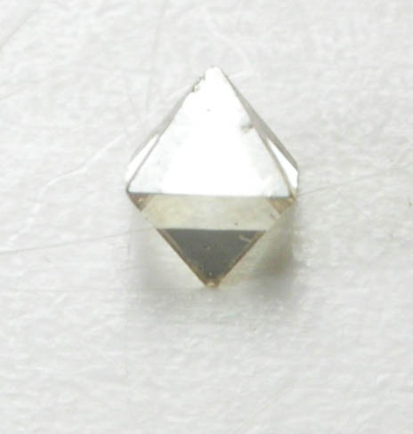 Diamond (0.03 carat pale-brown octahedral crystal) from Fuxian, Lianing Province, China