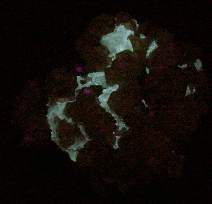 Photo below under shortwave ultraviolet illumination of Grossular Garnet with Calcite from Handan, Hebei, China Grossular Garnet with Calcite from Handan, Hebei, China