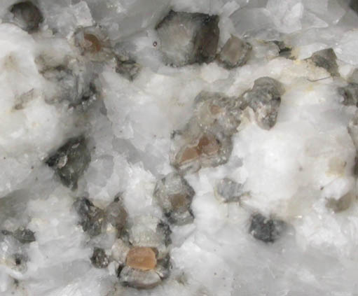 Periclase with Brucite alteration rims from Crestmore Quarry, 440 Level, 1620 North, Riverside County, California