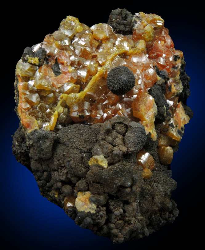 Mimetite var. Campylite on Psilomelane from Drygill Mine, Caldbeck Fells, Cumbria, England