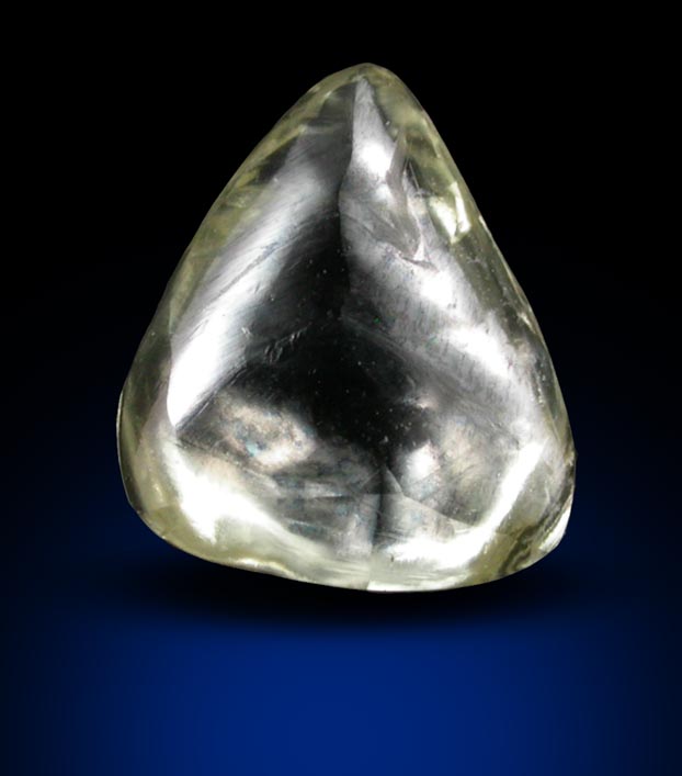 Diamond (0.69 carat cuttable yellow flattened triangular crystal) from Sakha (Yakutia) Republic, Siberia, Russia