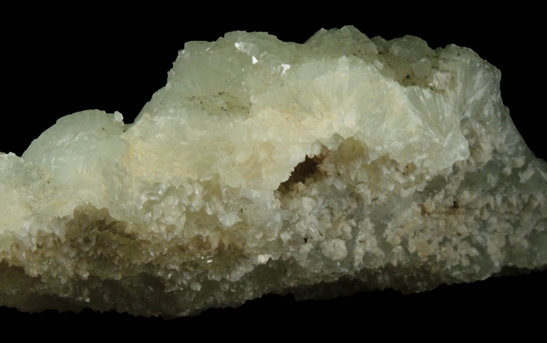 Prehnite with pseudomorphic molds after Laumontite from Lower New Street Quarry, Paterson, Passaic County, New Jersey