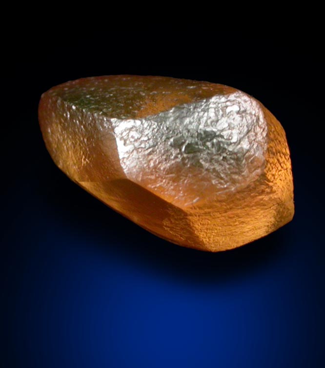 Diamond (1.29 carat orange distorted cuttable dodecahedral crystal) from Vaal River Mining District, Northern Cape Province, South Africa
