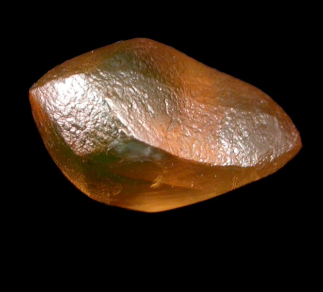 Diamond (1.29 carat orange distorted cuttable dodecahedral crystal) from Vaal River Mining District, Northern Cape Province, South Africa